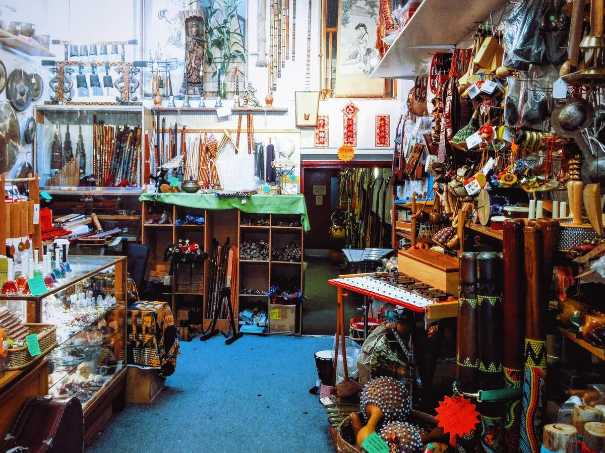 The interior of the shop is also filled to the brim with all sorts of instruments. Chinese paintings and decor hang from the walls.
