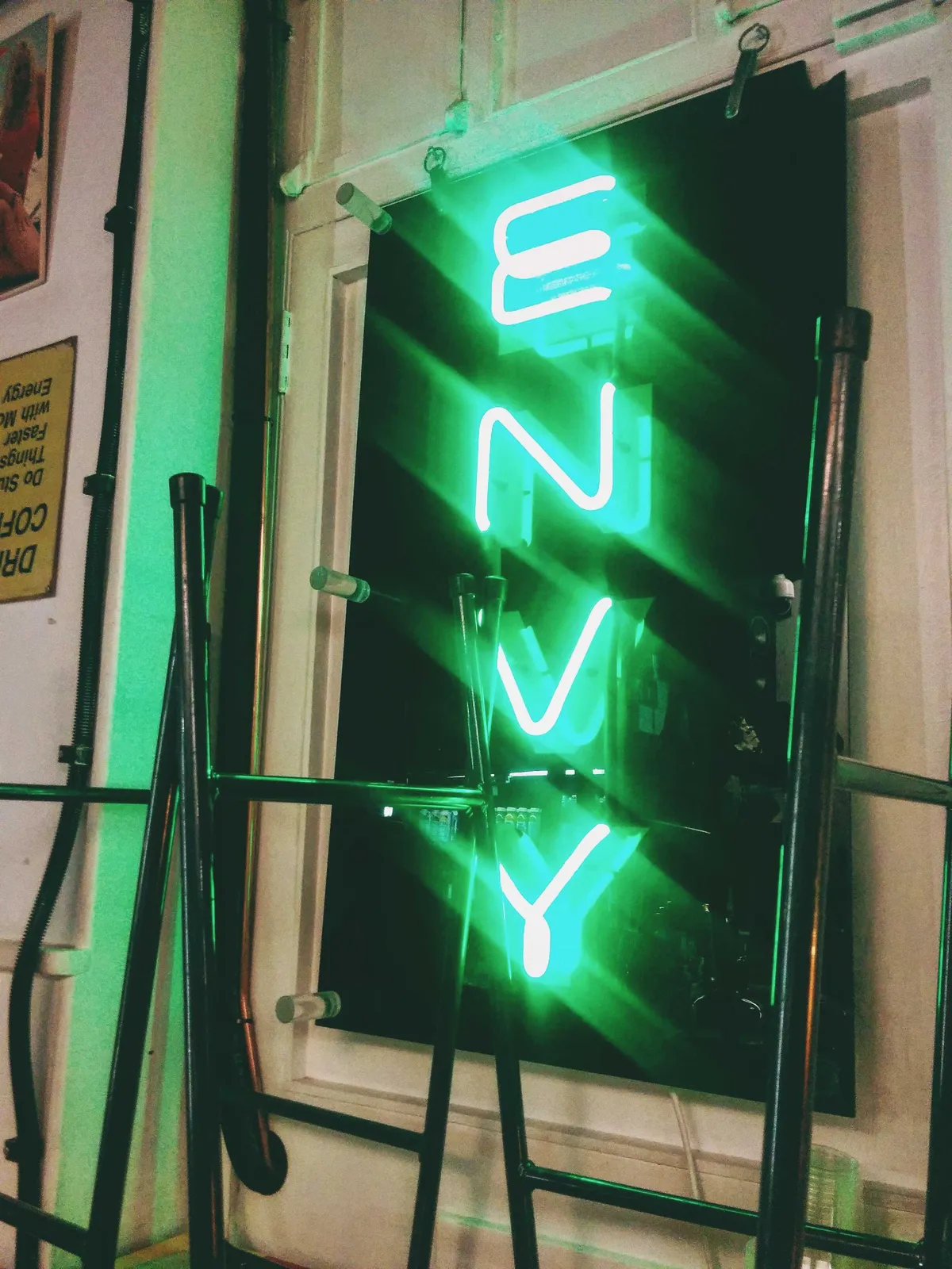 A neon green sign with the word 