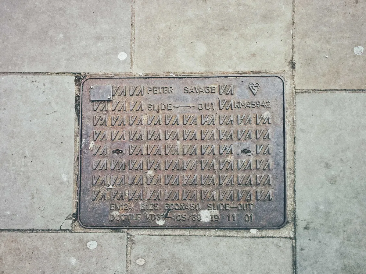 Grate cover that says 