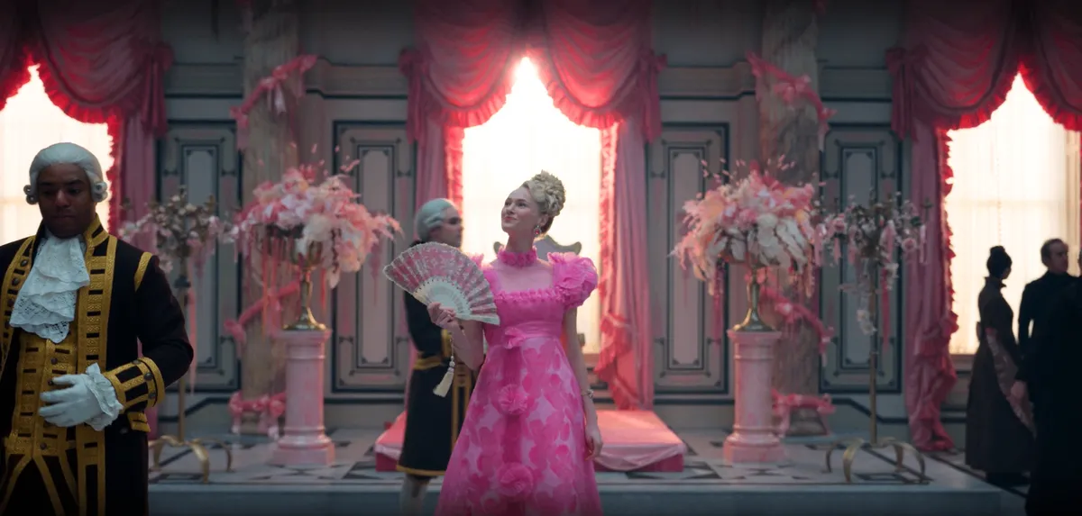 Cressida stands in the center of the grand hall of the Penwood House, decorating every inch of it in pink.