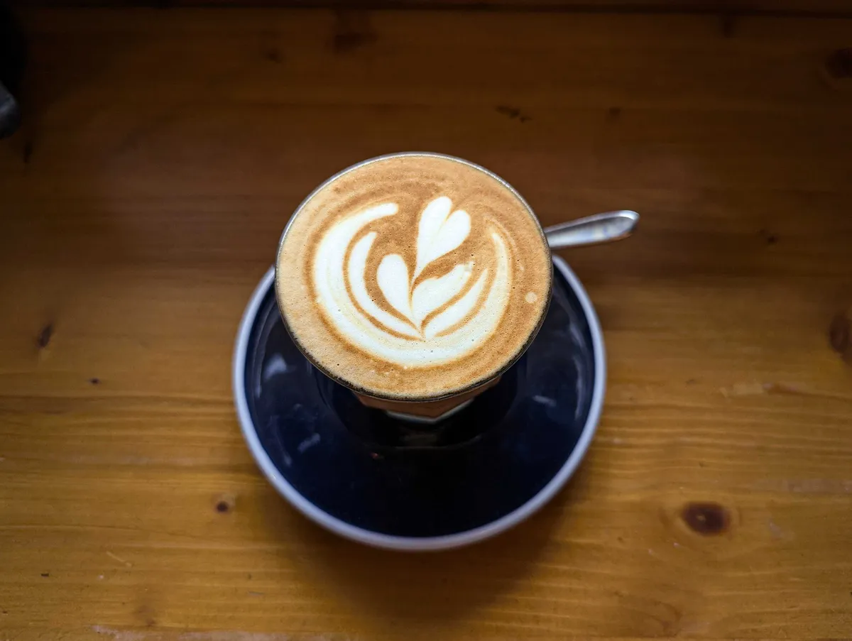 A flat white with pretty latte art.