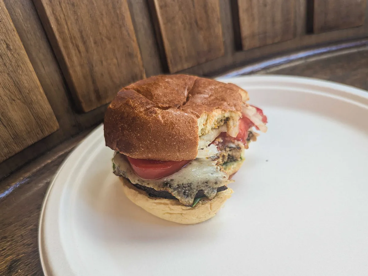 A hamburger that's been bitten into.