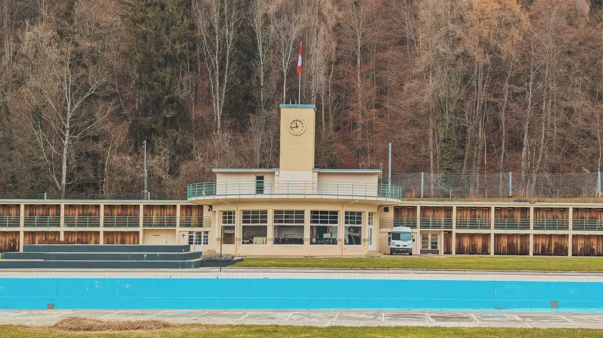 A closer crop of the pool and clock tower. The photo has been edited so that the browns and blues pop out more.