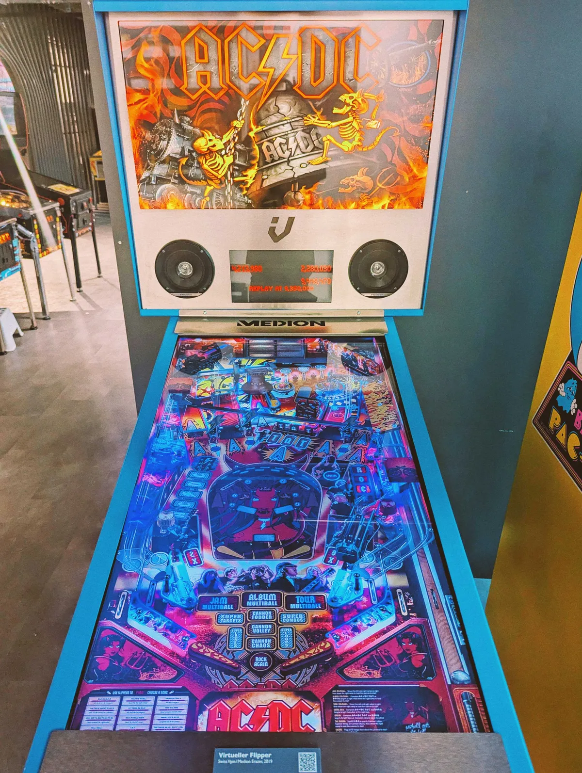 An AC/DC-themed pinball machine, where the pinball area is a giant, digitized screen.
