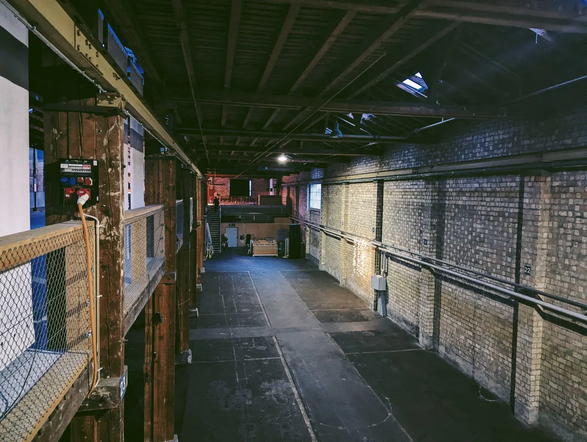 A view of the ground floor. It's just a long driveway, large enough to fit several buses.