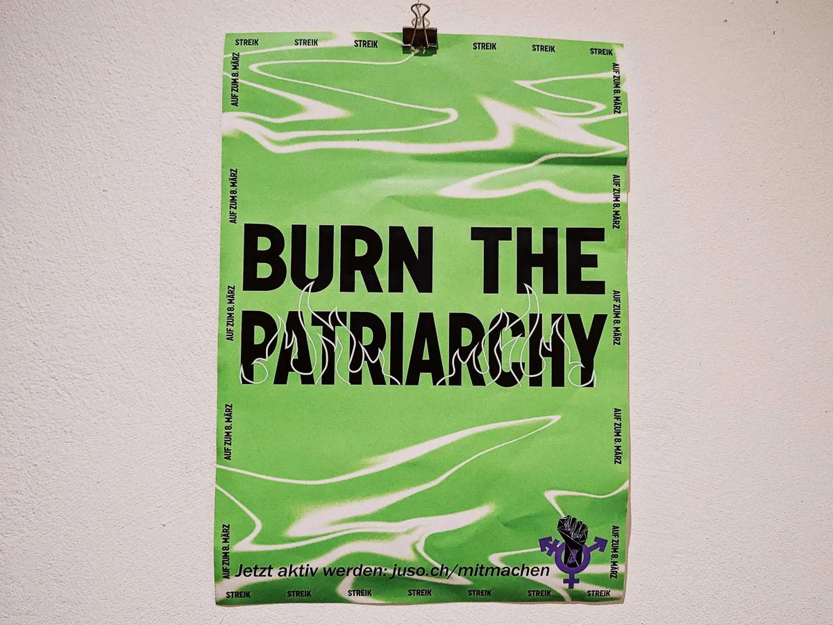 A bright green poster that says, "Burn the patriarchy" in all caps.