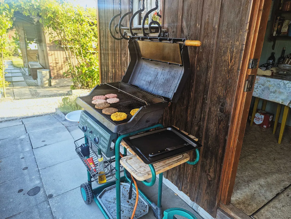 Patties grilling on the grill.