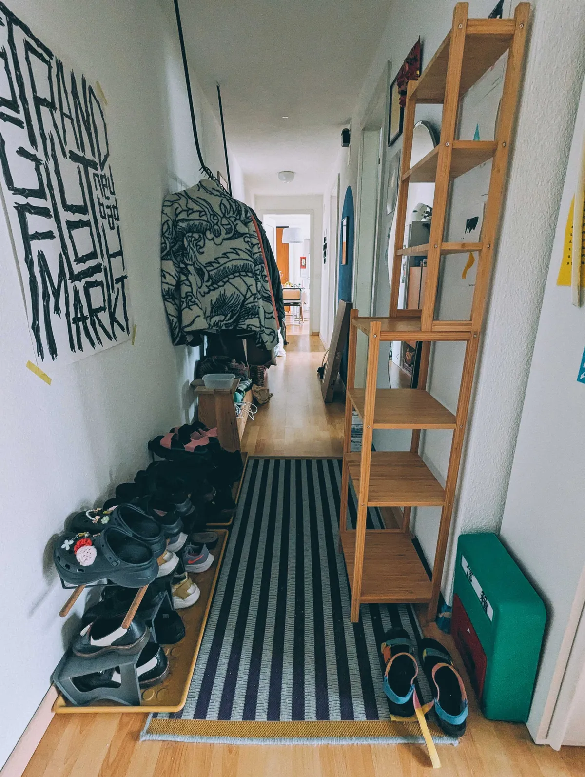 Hallway with an extra pair of shoes on the floor.
