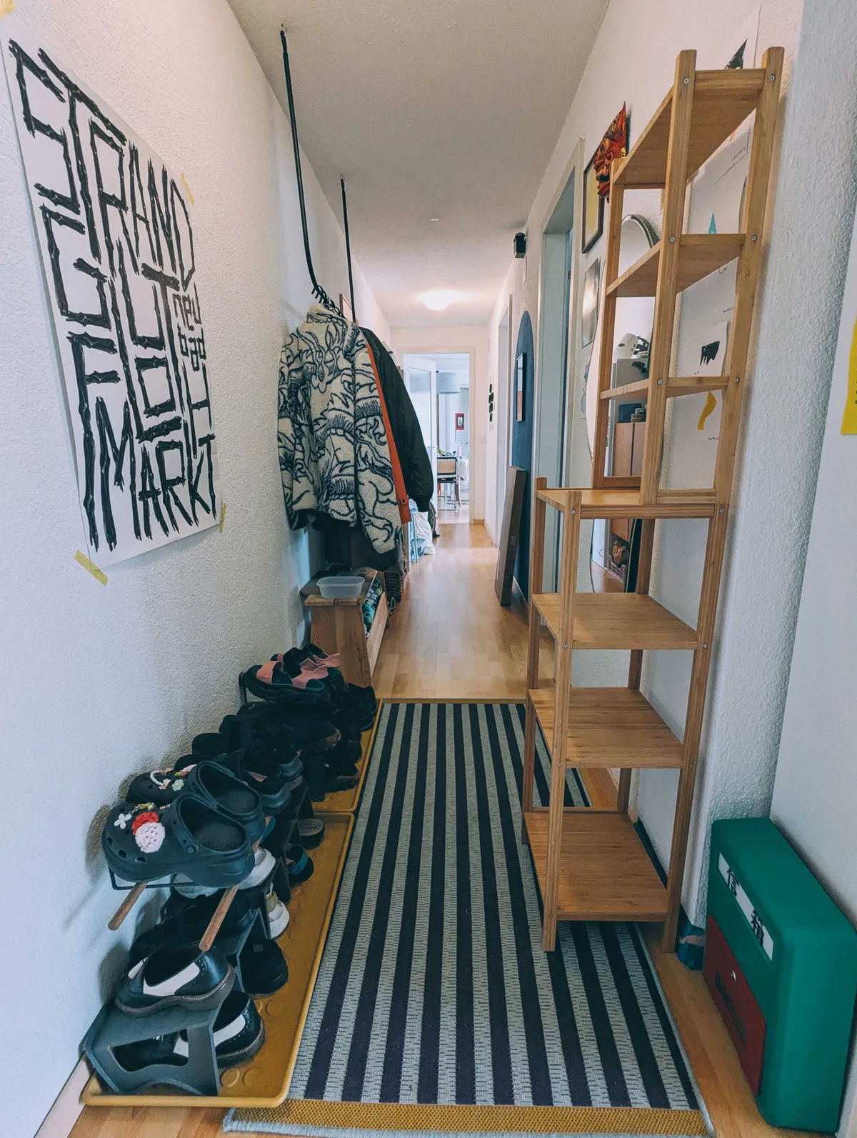 A seemingly cleaner hallways; extra pair of shoes removed from the scene.