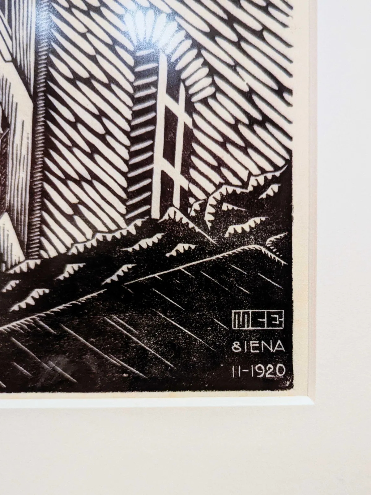 A close-up of M.C. Escher's initials, which looks like a modern-day graffiti tag.