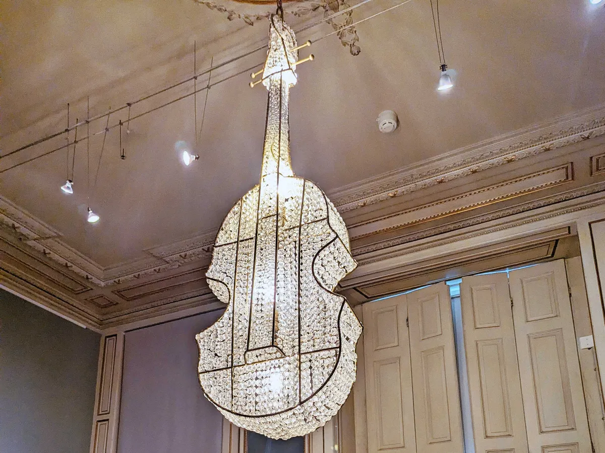 Chandelier in the shape of a cello.