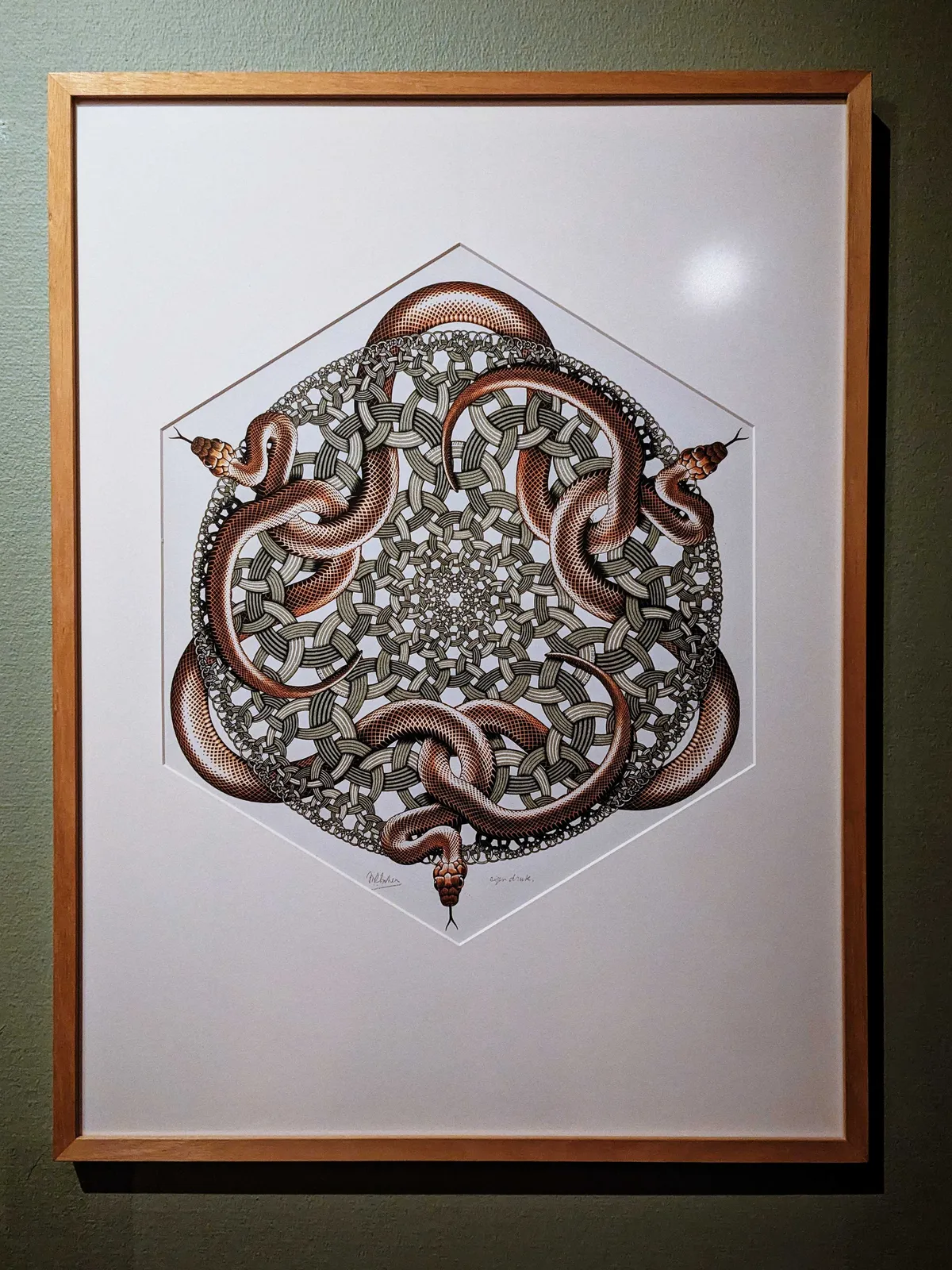 An ornate pattern with slithering snakes in high detail and intricate geometric patterns. This piece is titled, 