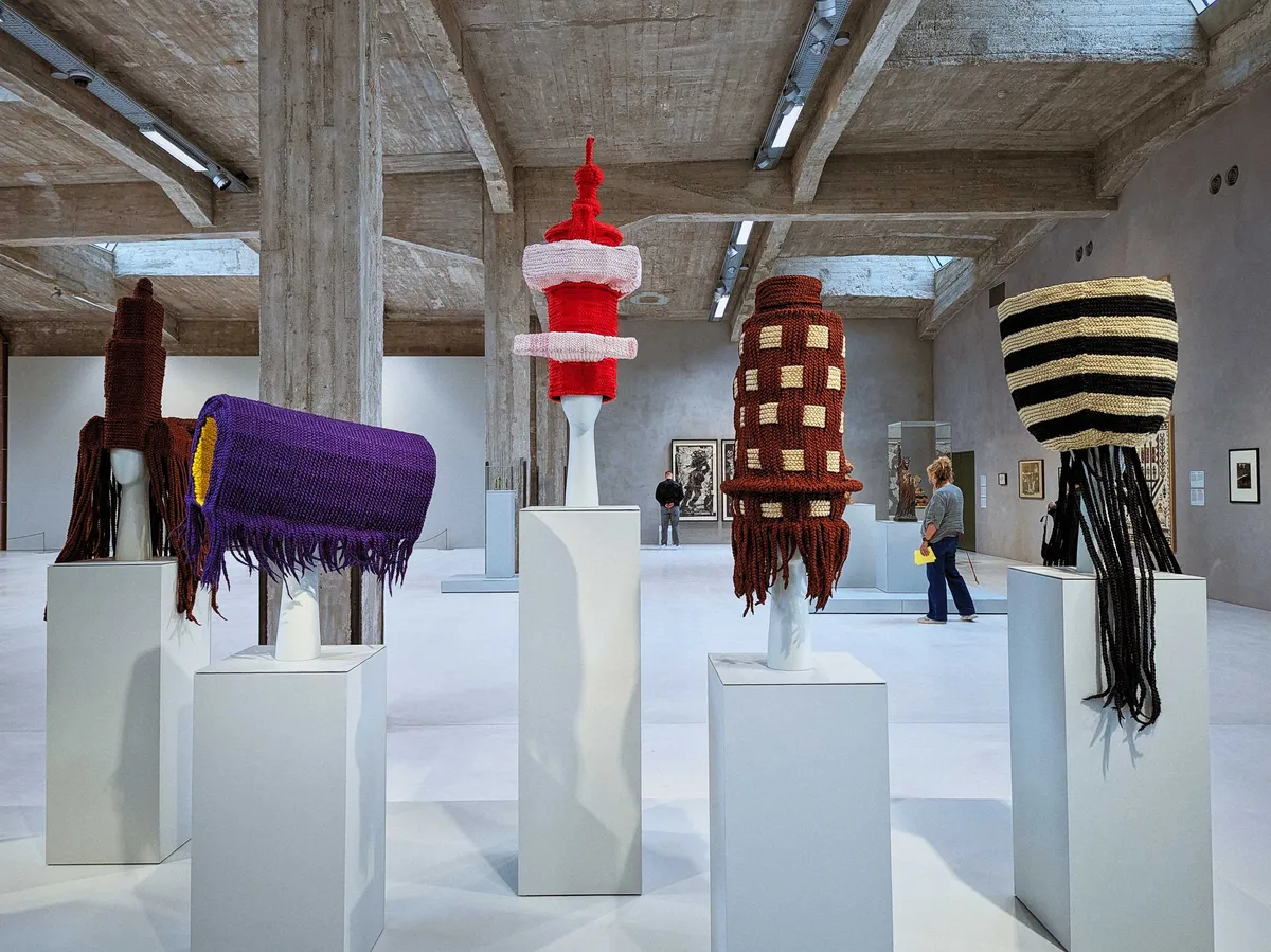 A series of monuments made out of yarn and woven using different styles of African hair braids.