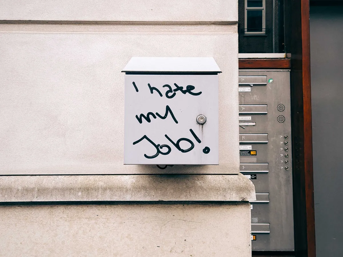 A locked box on the side of a building with the words, 