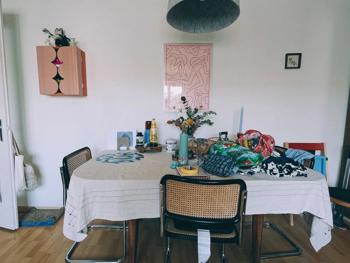 The same dining table but now the left side is clutter-free and organized. The other half is the same.
