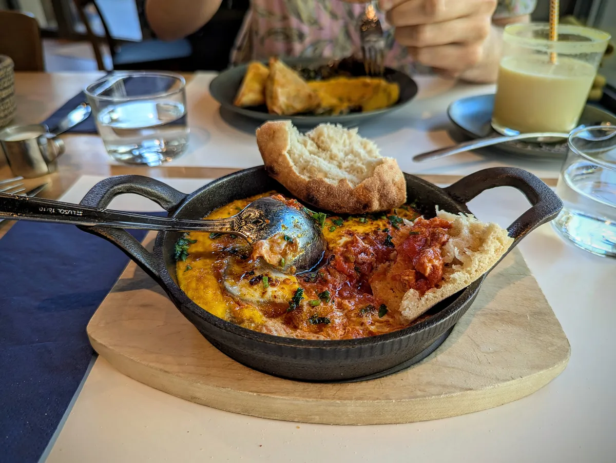 Shakshuka in a mini cast iron pan.