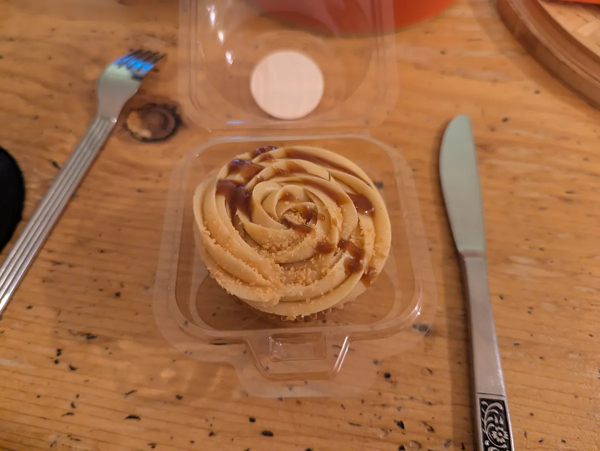 A cupcake with salted caramel frosting.