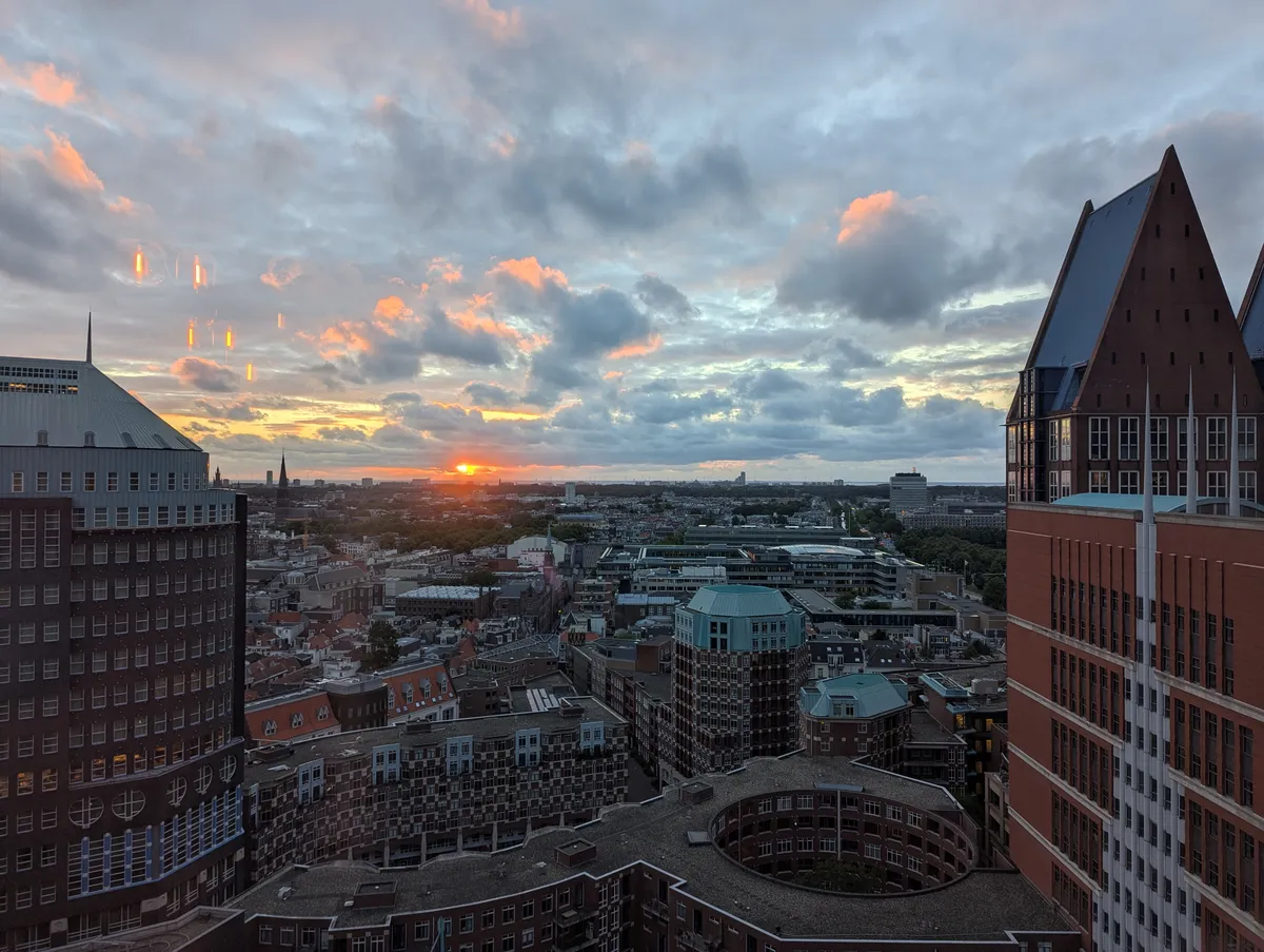 Sunset over buildings in The Hague.