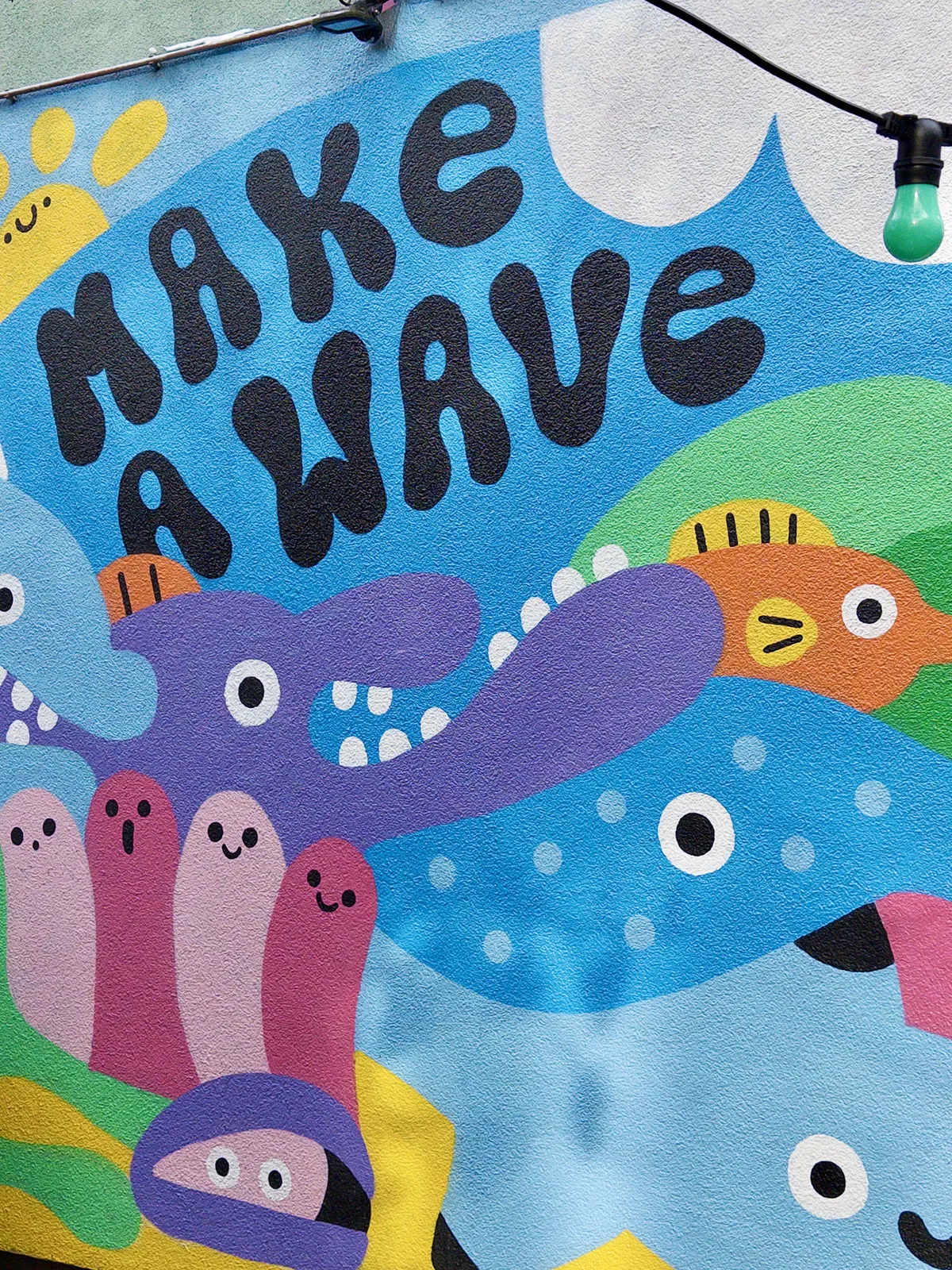 Colorful mural featuring the text 