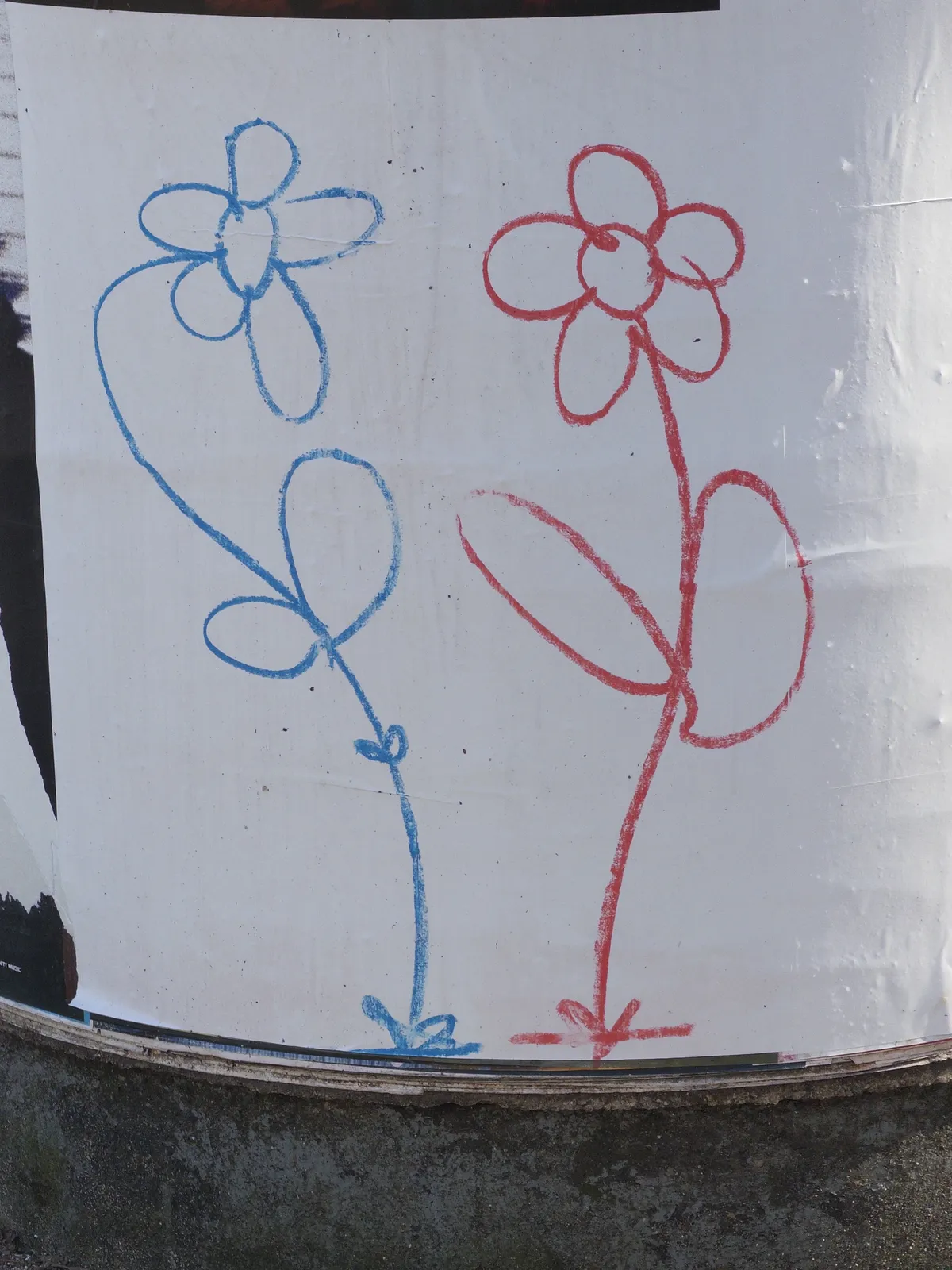 Two simple flower drawings on a white poster: one blue flower with a round center and curved petals on the left, and one red flower with a similar design on the right. Each flower has a stem and leaves depicted in a minimalist style.