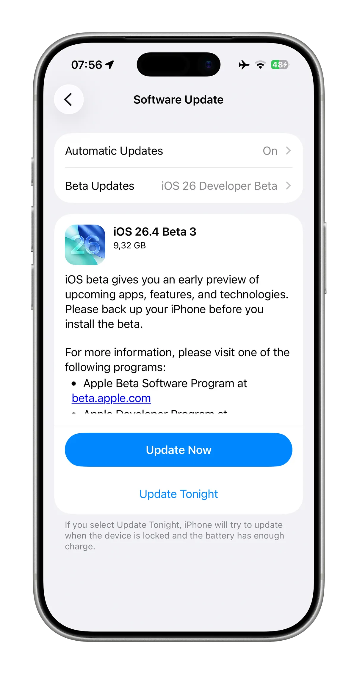 The screen displays a software update interface for an iPhone, detailing the iOS 26.4 Beta 3 update of 9.32 GB. It includes information about backing up the device and links to the Apple Beta Software Program and Apple Developer Program, along with an option to update now or tonight.