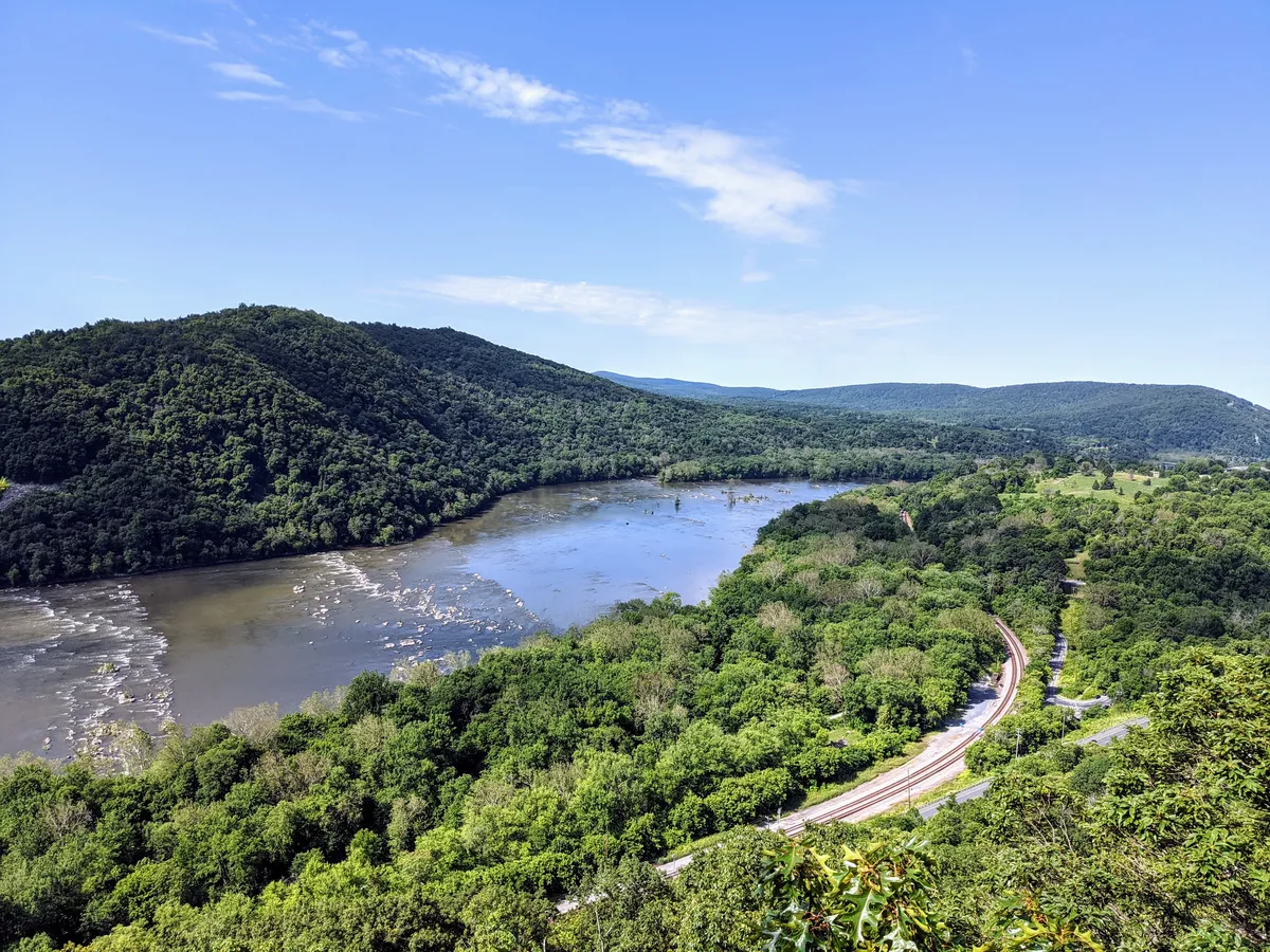 The view from the peak of a hike overlooking the Potomac River and the hills outside of Harpers ferry West Virginia