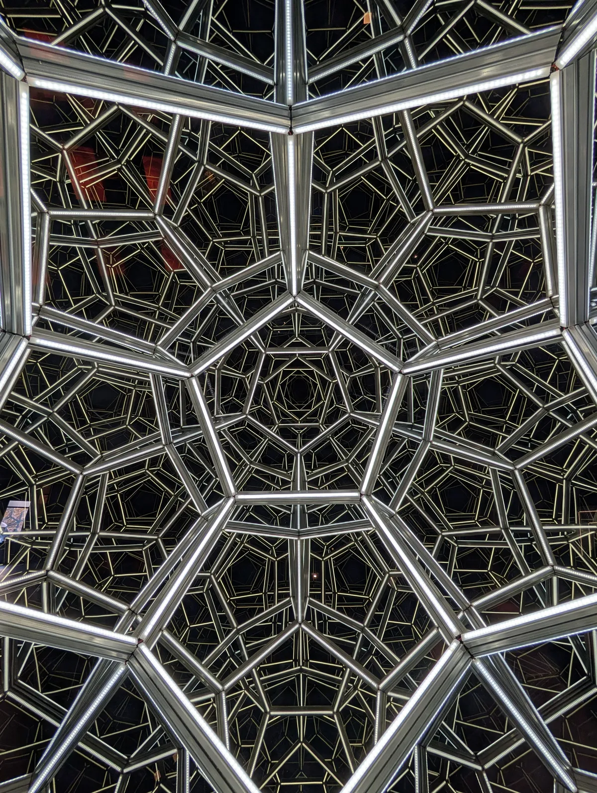 a seemingly infinite chasm of pentagonal lights