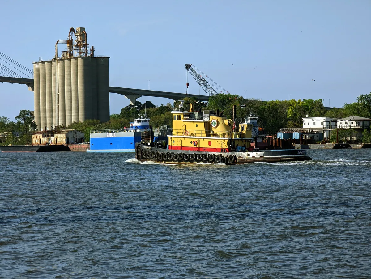 a little yellow Tugboat in the Savannah River