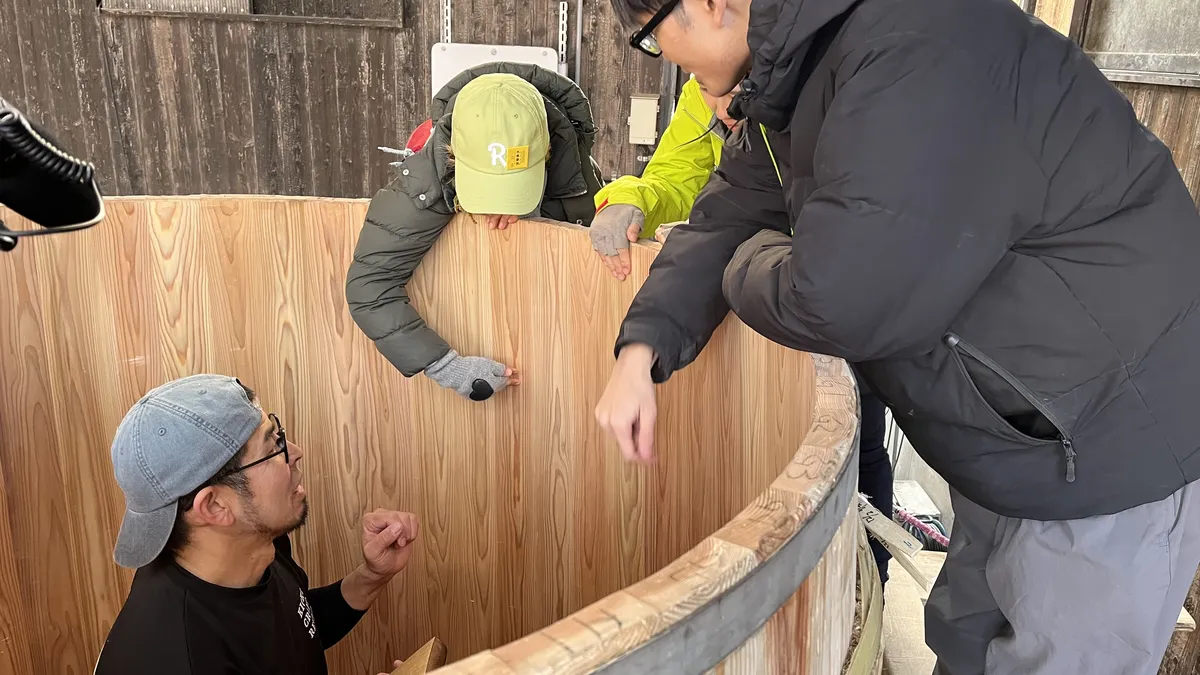 Inspecting and planing the joints on the inside wall of a Kioke