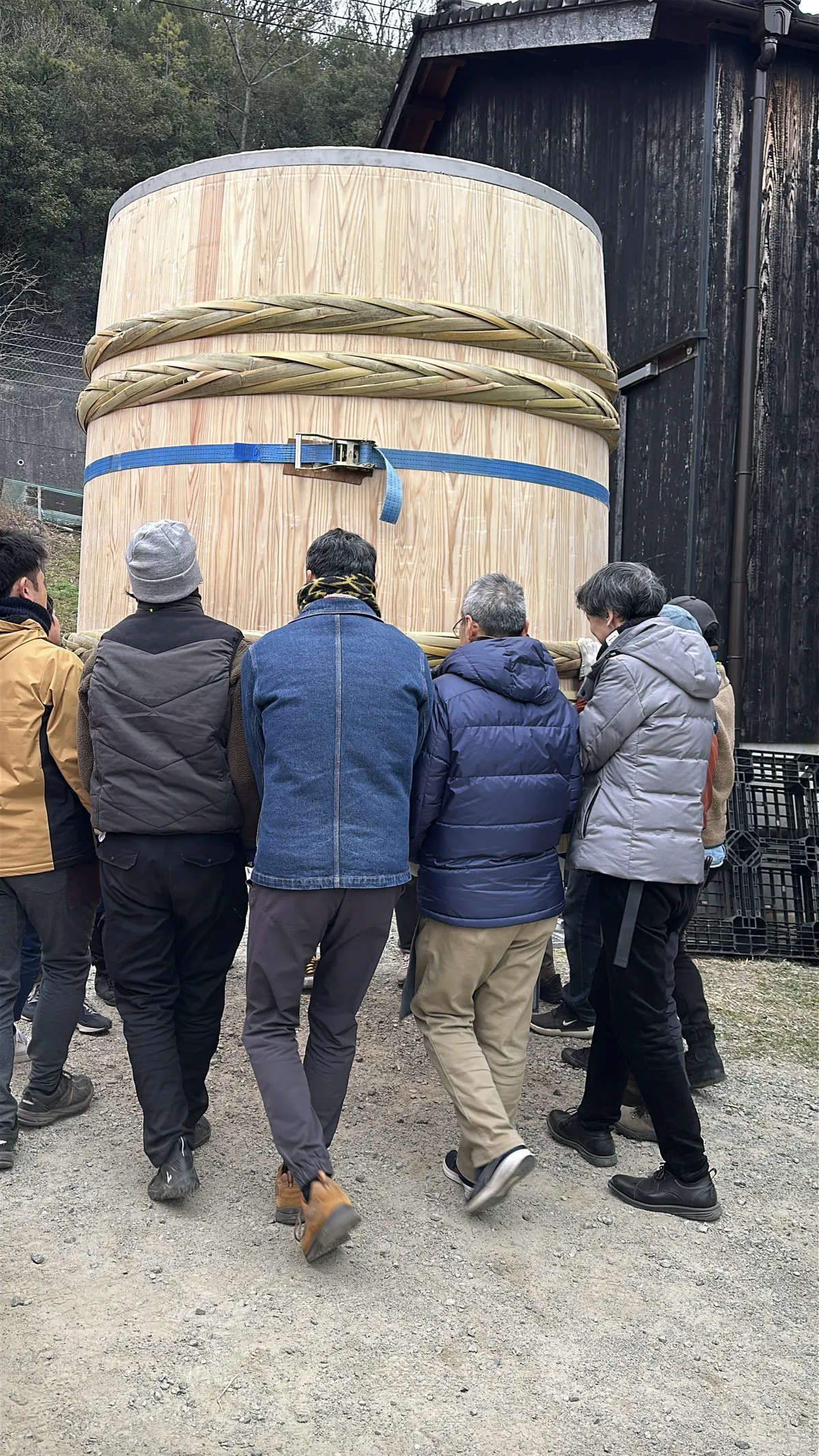 Moving the newly born Kioke into the brewery. I am the one with the grey hat, It was very heavy! Photo Credit: picture shared with me by an attendant of the summit, I forgot who :(