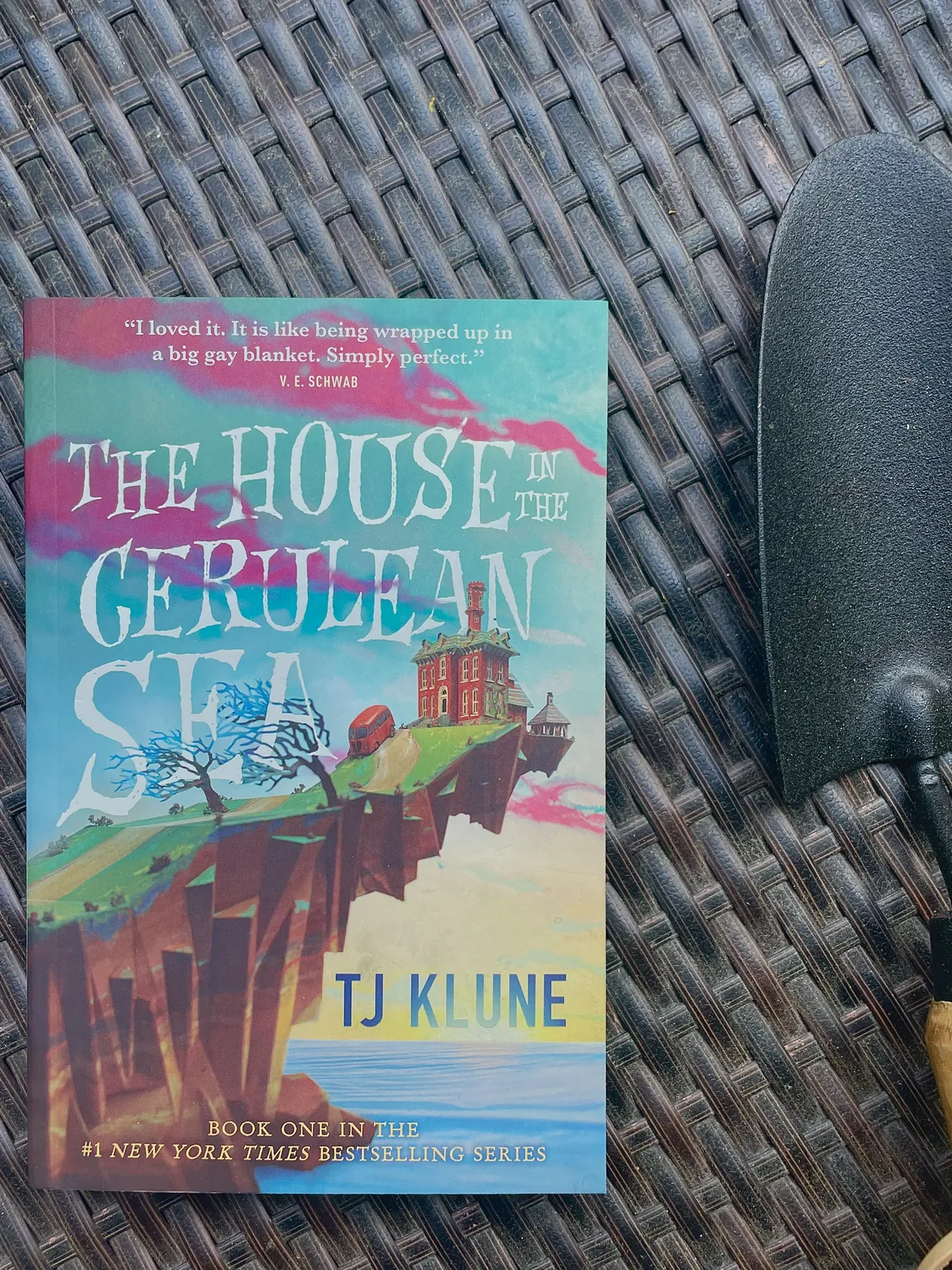 The House in the Cerulean Sea next to a trowl