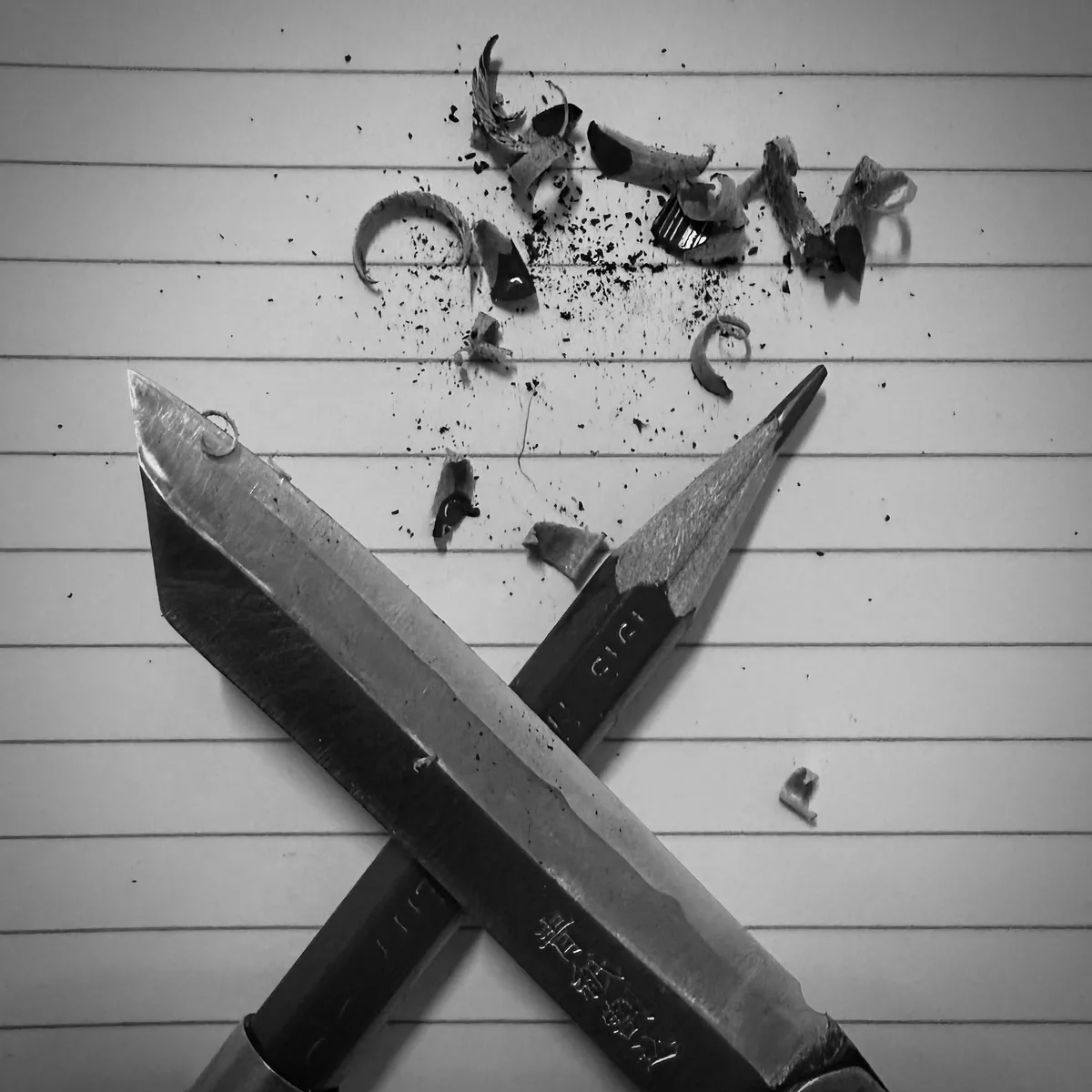 A sharpened pencil and knife