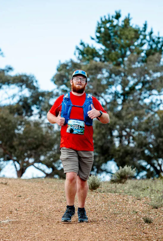 Jake running over the crest of a hill