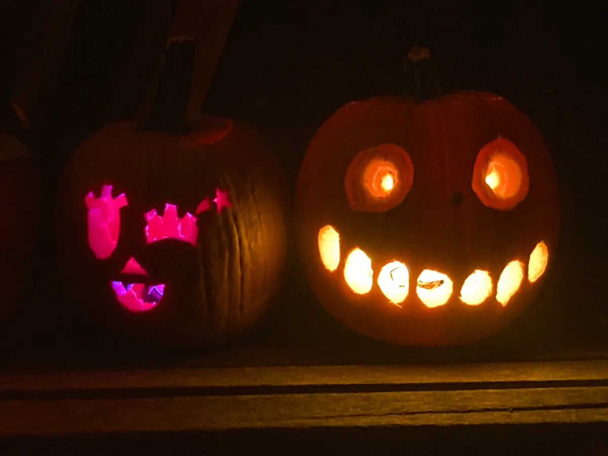 A pumpkin with a cute winking face, next to a pumpkin with the face of the Pokémon Cacturne
