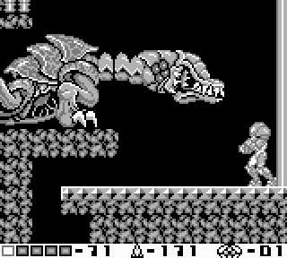 a screenshot of samus aran standing opposite the queen metroid, from metroid ii: samus returns. the queen occupies almost 25% of the total screen space