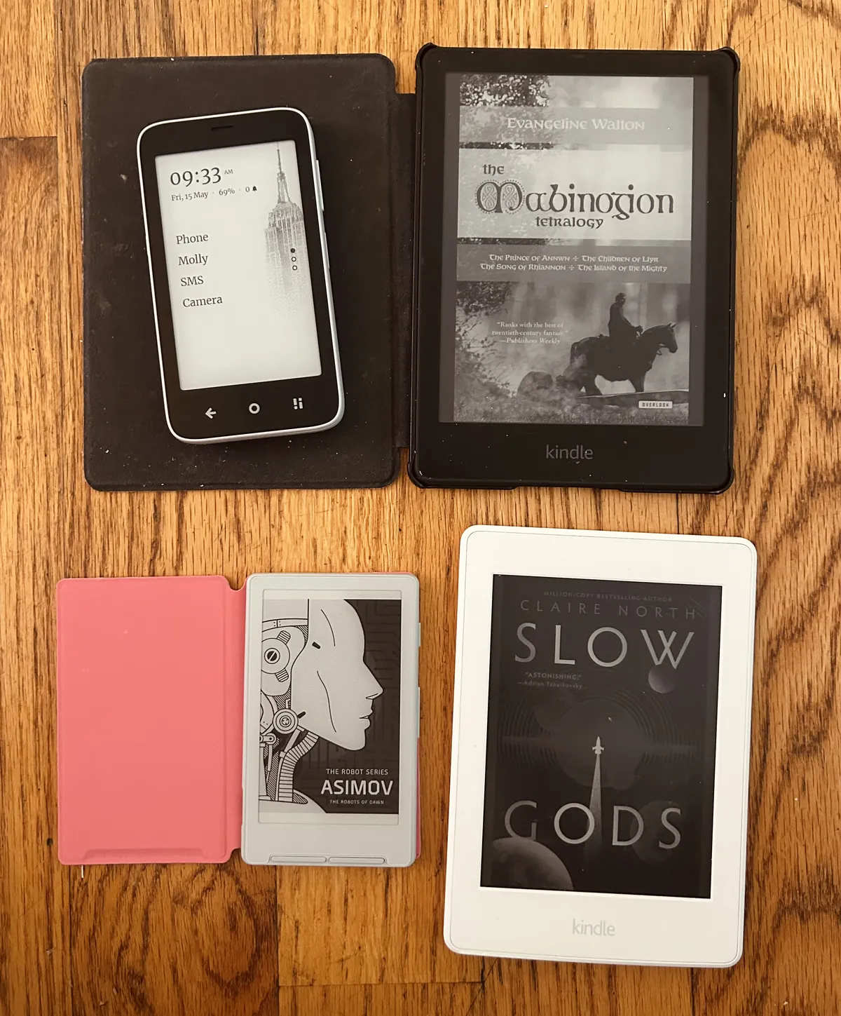 Two Kindle Paperwhites, an Xteink X4 and the Mudita Kompakt