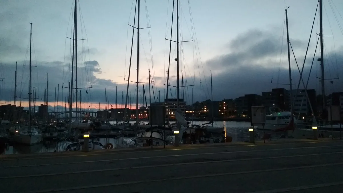 A view of a harbour under the midnight sun
