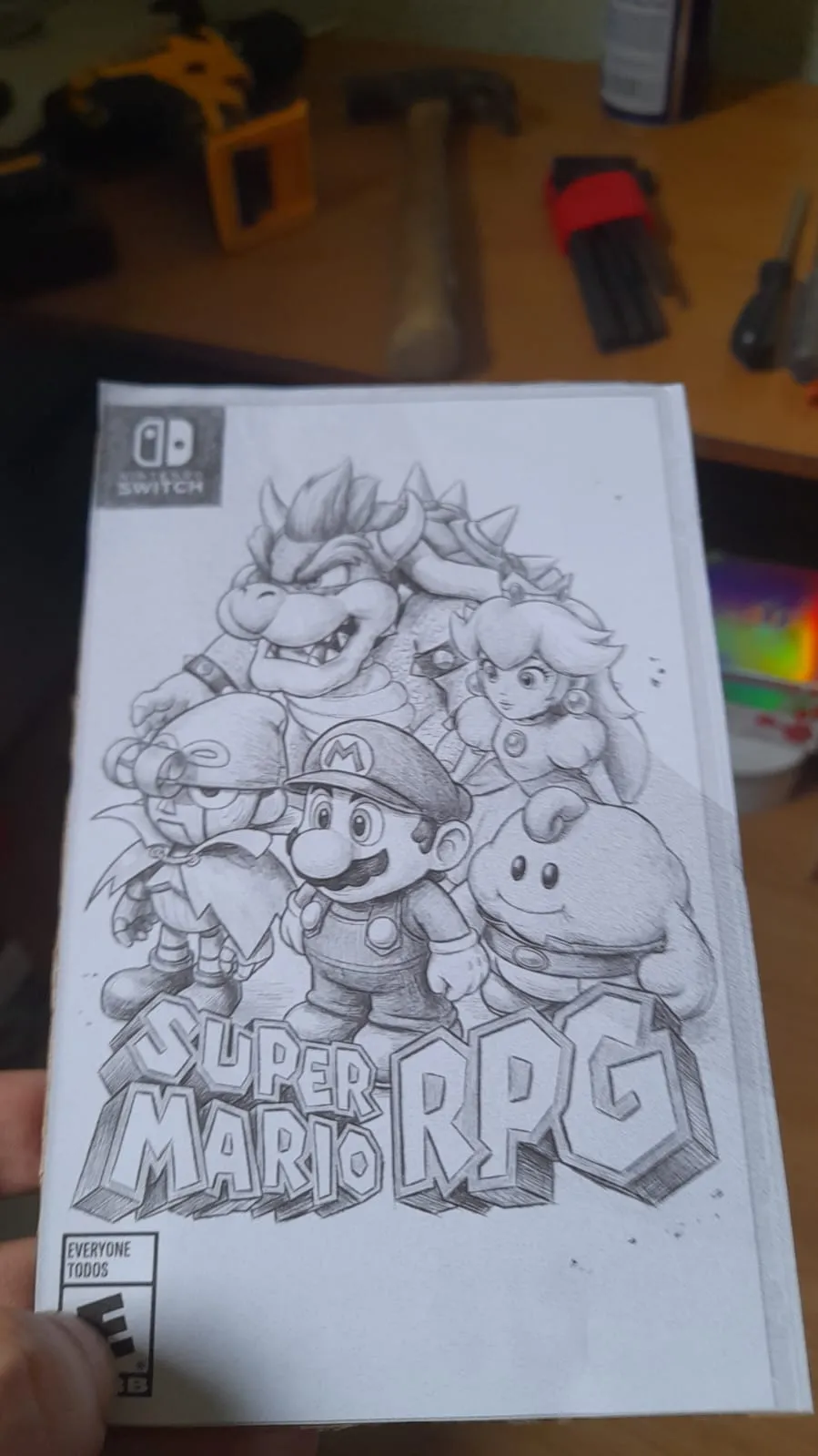 Capa de jogo impressa em preto e branco e colada em papelão