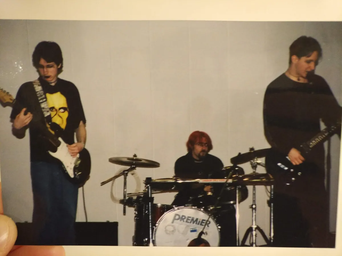 an old photo of a goth band in the '90s - necromancy