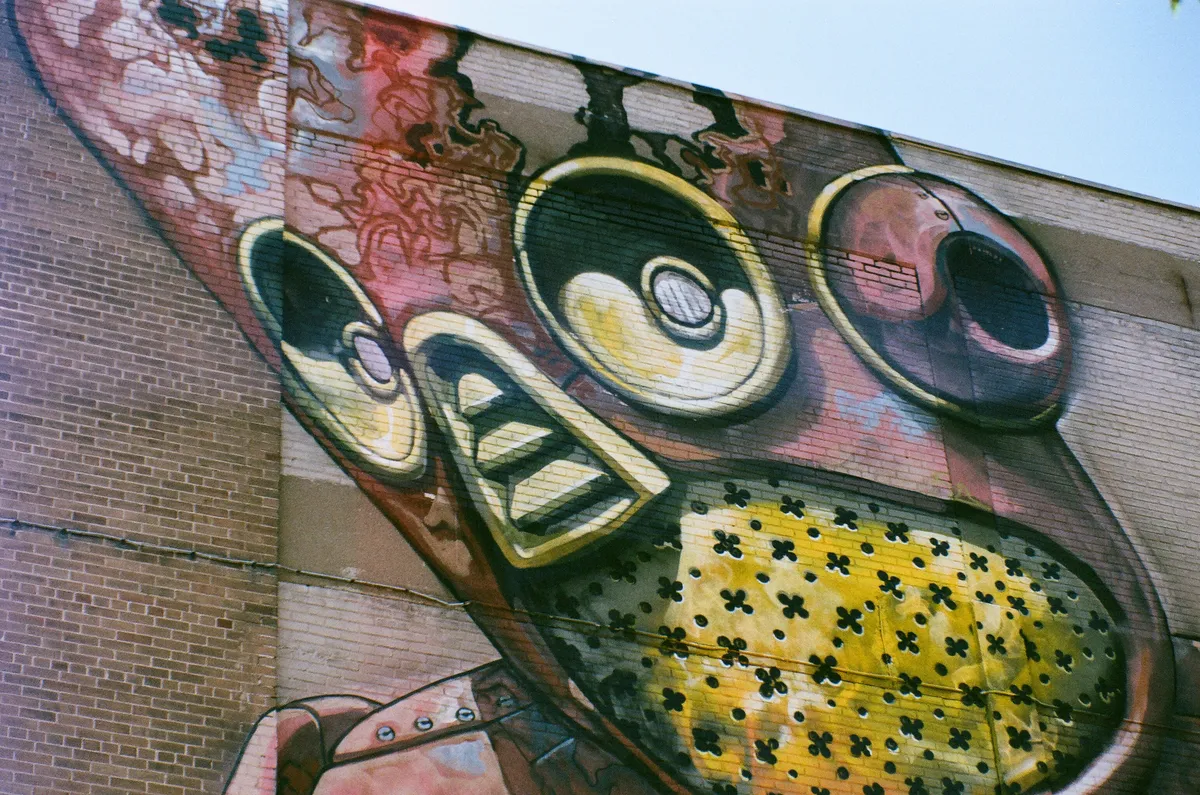 A mural of a robot on the side of a building