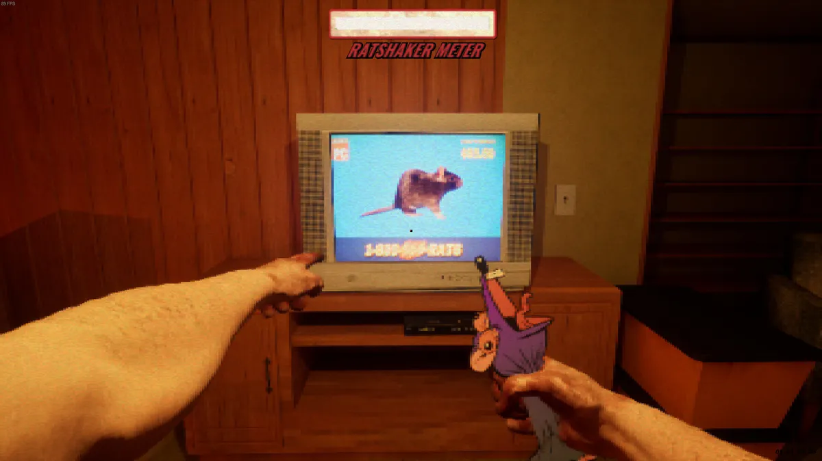 screenshot from the game ratshaker, depicting two arms from a first person view, with one hand holding a rat and the other pointing at a CRT