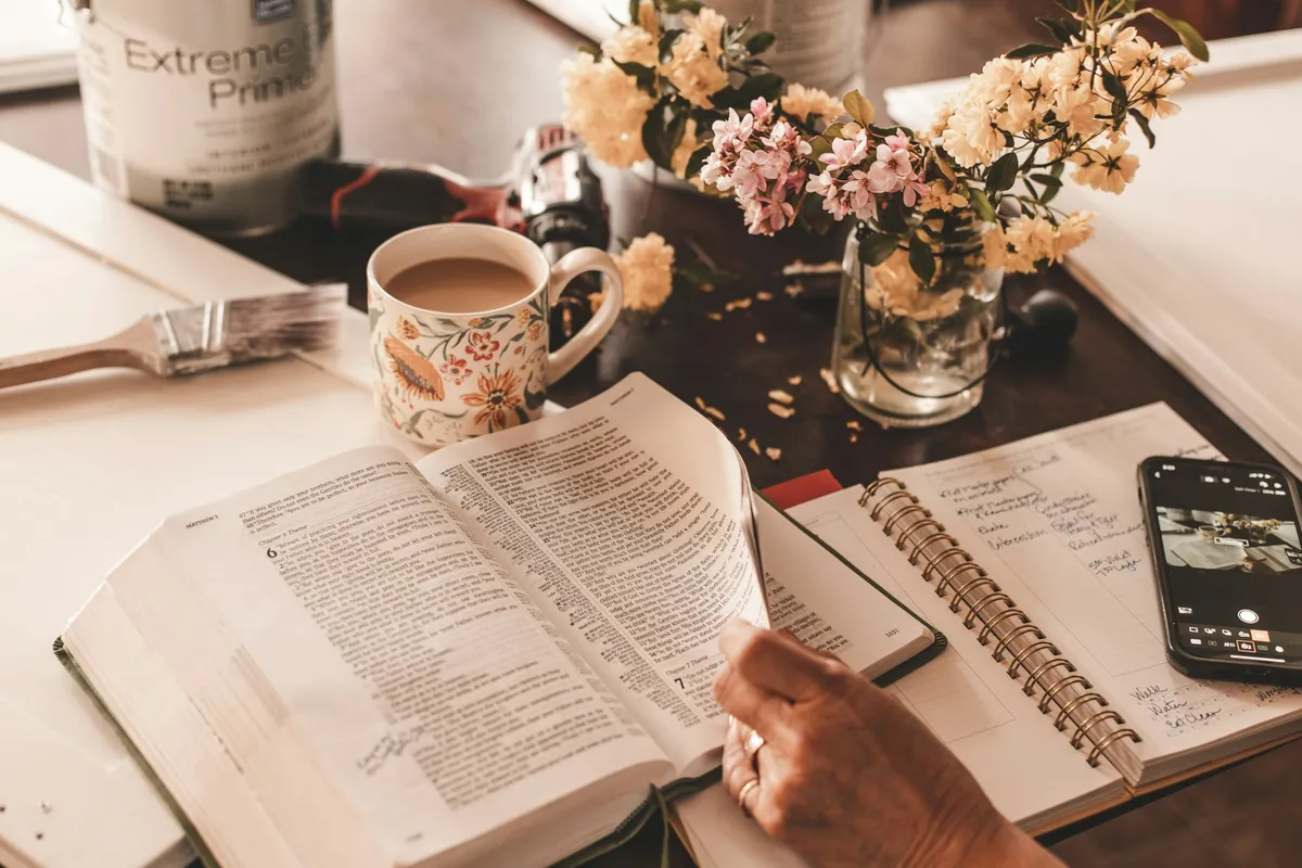 Person with Book and Coffee