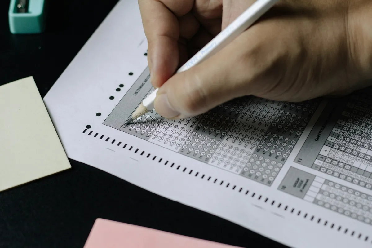 Person Writing on Paper