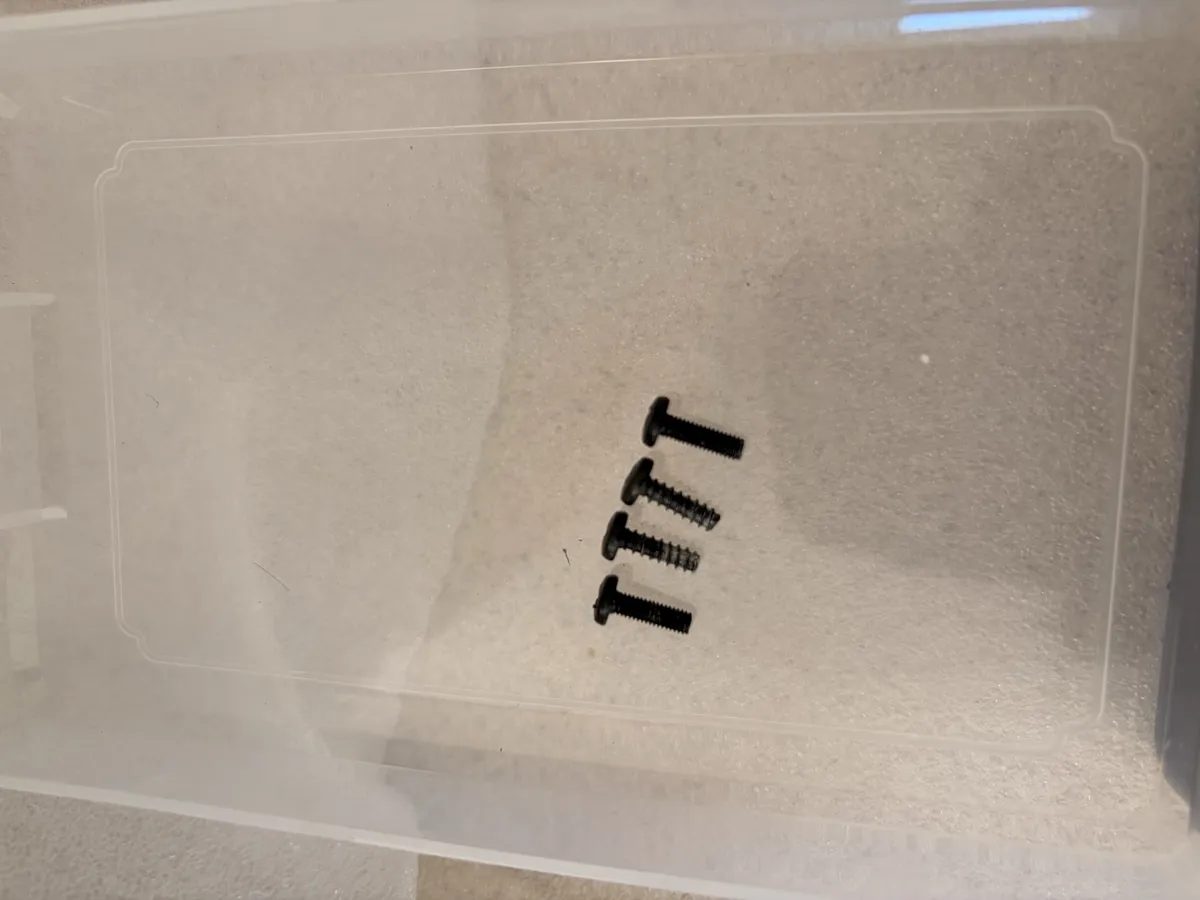 Four screws in a row, two coarse self-tappers and two fine machine threads