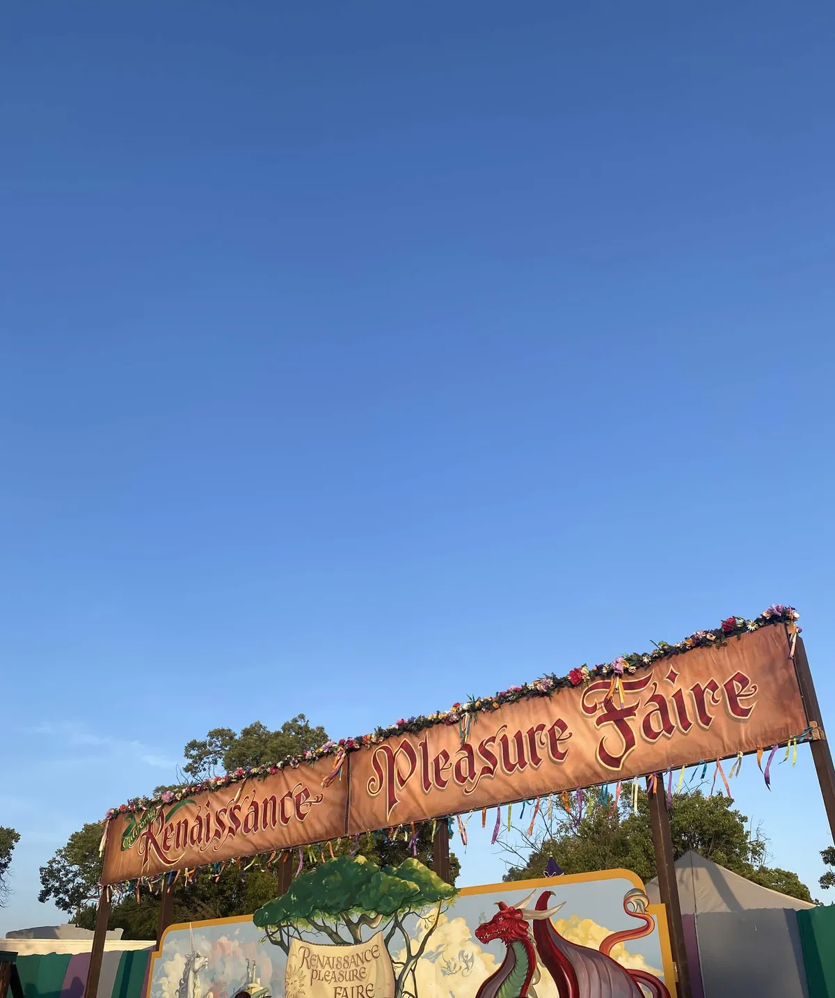 Photos of a clear blue sky. Below is a decorated banner reading "Renaissance Pleasure Faire"
