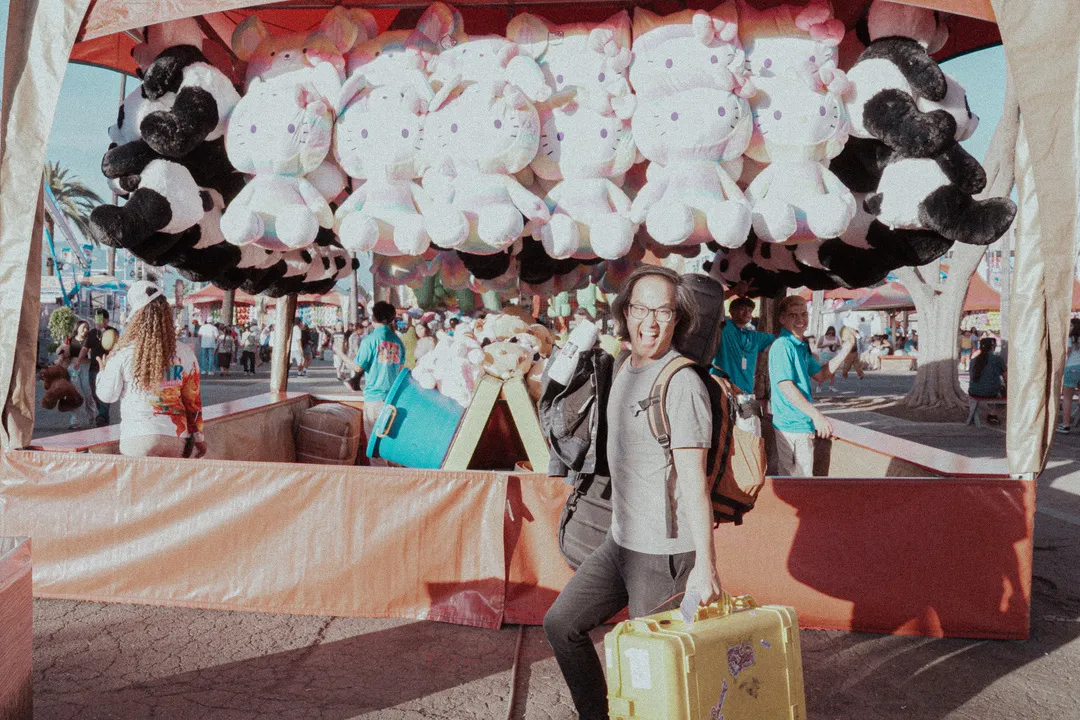 20250512 Ben in front of a lot of plushies