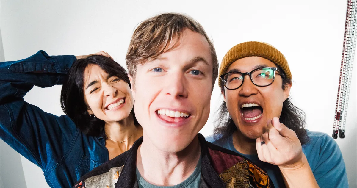 Clara, Jon and Ben close up making faces