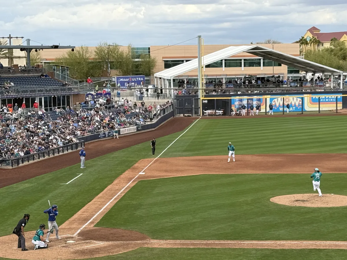 Andrés Muñoz winds up to pitch against Bobby Witt Jr.