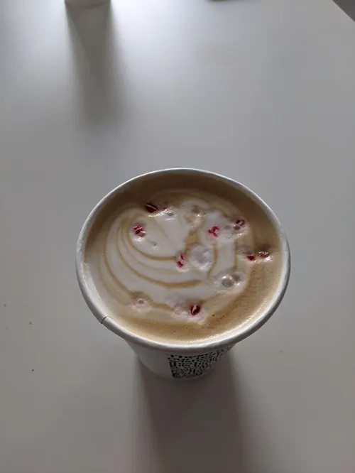 latte art with peppermint pieces in it, a peppermint mocha
