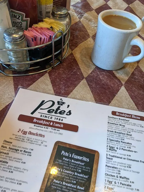 a Pete's Diner menu and coffee in a ceramic mug